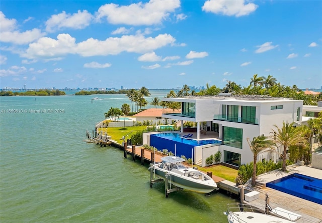 birds eye view of property with a water view