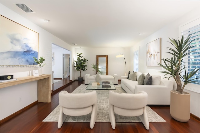 living room with dark hardwood / wood-style floors