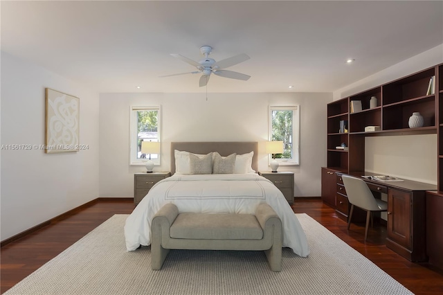 bedroom with dark hardwood / wood-style floors, multiple windows, and ceiling fan