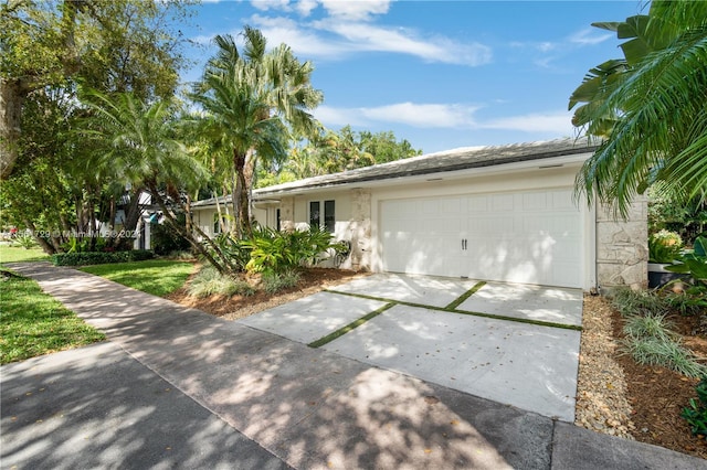 single story home with a garage