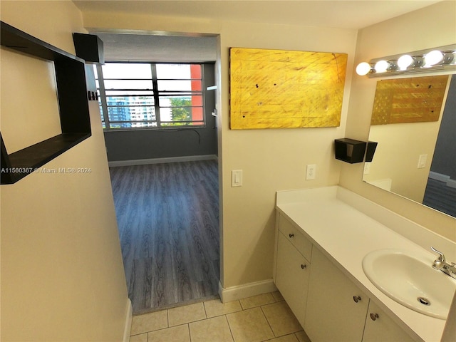 bathroom featuring vanity with extensive cabinet space and tile floors