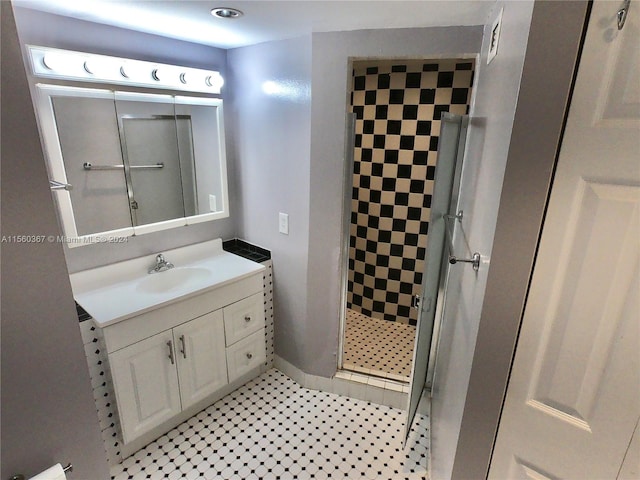 bathroom with vanity, tile floors, and walk in shower