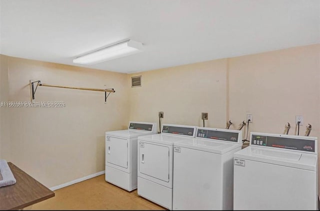 laundry room featuring washing machine and dryer, hookup for an electric dryer, and hookup for a washing machine