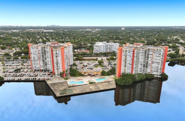 birds eye view of property featuring a water view