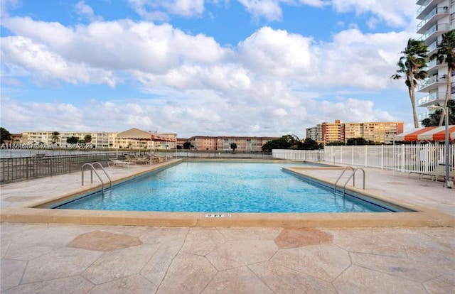 view of swimming pool featuring a patio area