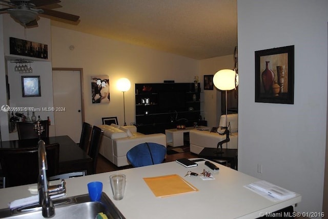 office area with ceiling fan and sink