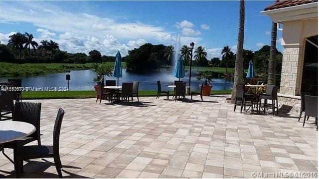 view of terrace with a water view