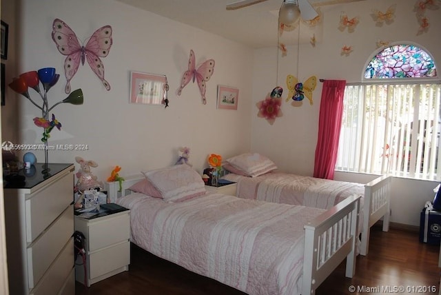 bedroom featuring ceiling fan and dark hardwood / wood-style flooring