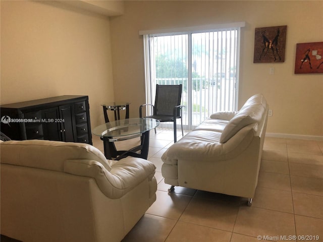 living room featuring light tile floors