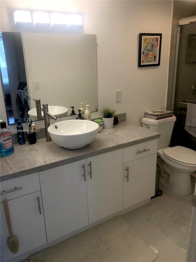 bathroom with toilet and vanity