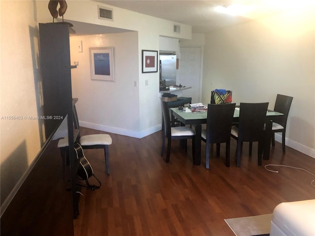 dining room featuring dark hardwood / wood-style flooring