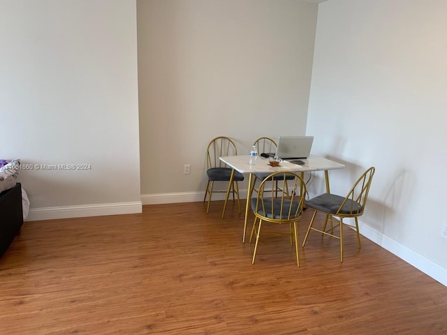 dining space with light hardwood / wood-style floors