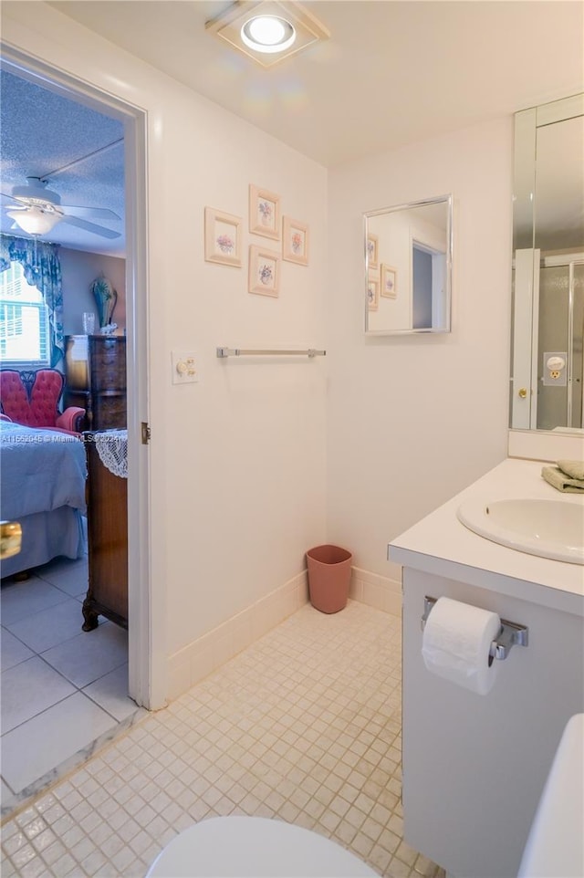 bathroom featuring tile floors and vanity