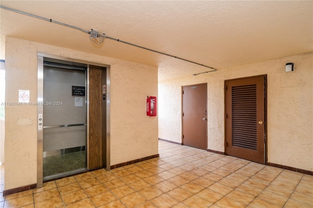 empty room featuring light tile floors