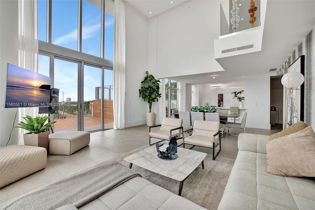 living room featuring a high ceiling