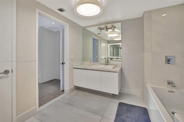 bathroom with tile floors and vanity