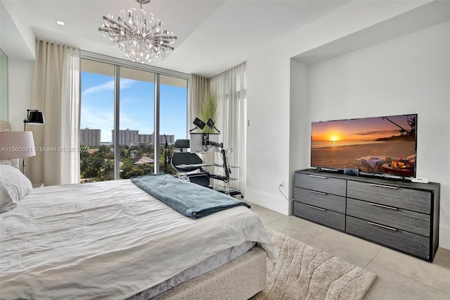 tiled bedroom with an inviting chandelier and expansive windows