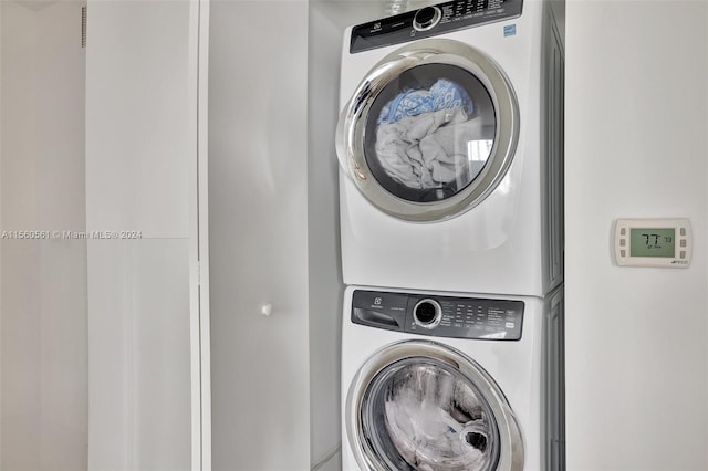 laundry room featuring stacked washer and dryer