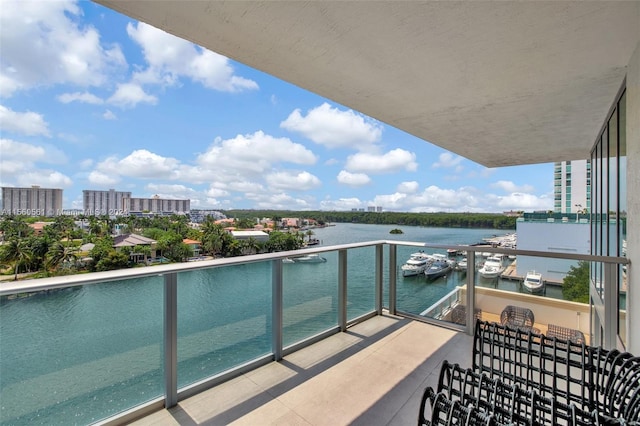 balcony featuring a water view