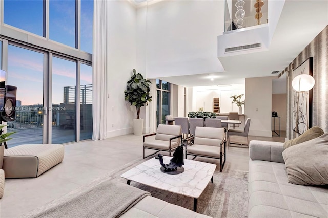 living room featuring a high ceiling