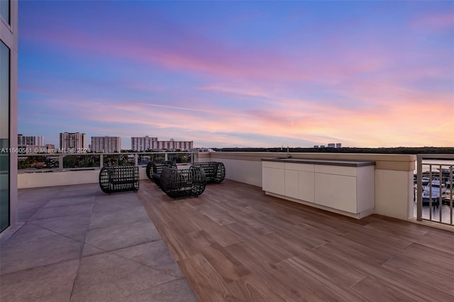 patio terrace at dusk with a balcony