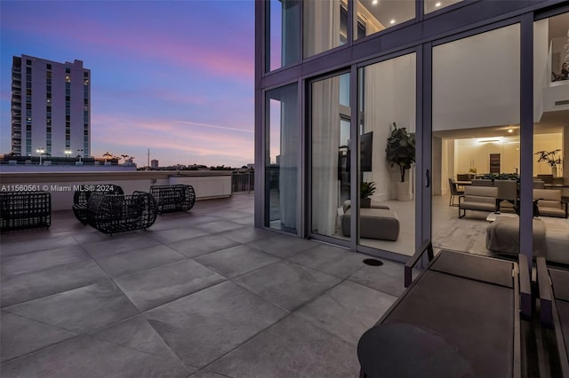 view of patio terrace at dusk