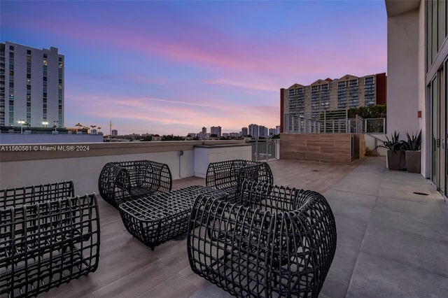 patio terrace at dusk with a balcony