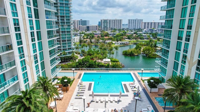 view of swimming pool featuring a water view