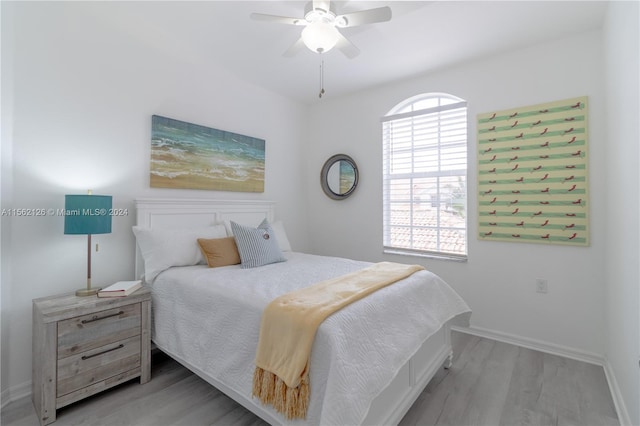 bedroom featuring light hardwood / wood-style floors and ceiling fan