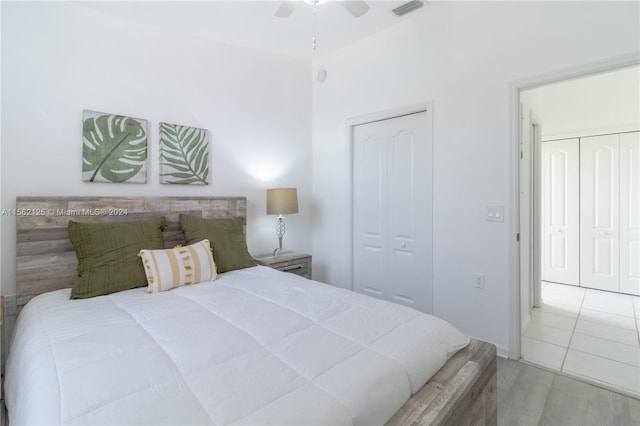 bedroom with light tile flooring and ceiling fan