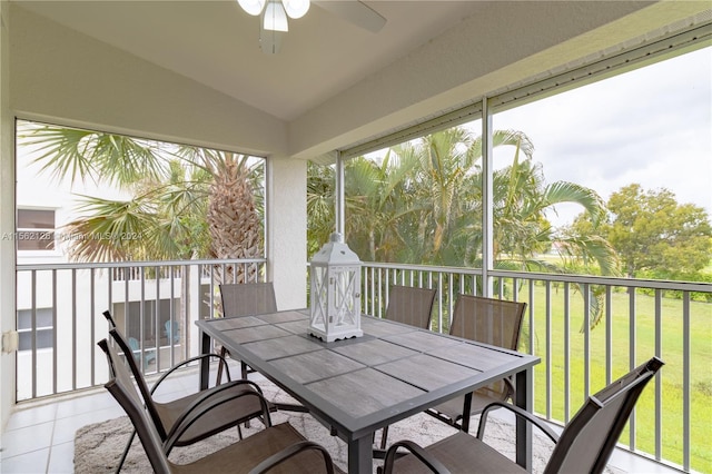 sunroom with lofted ceiling and ceiling fan