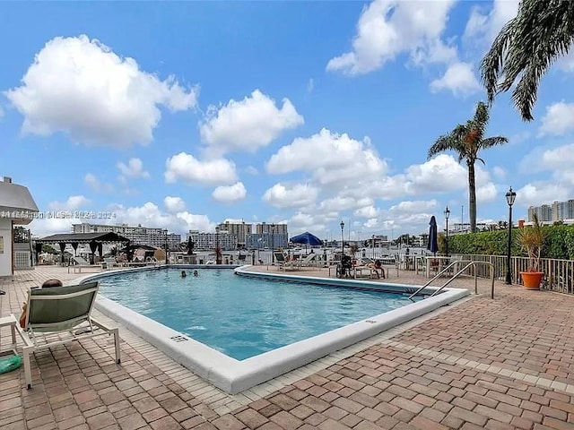 view of swimming pool featuring a patio area