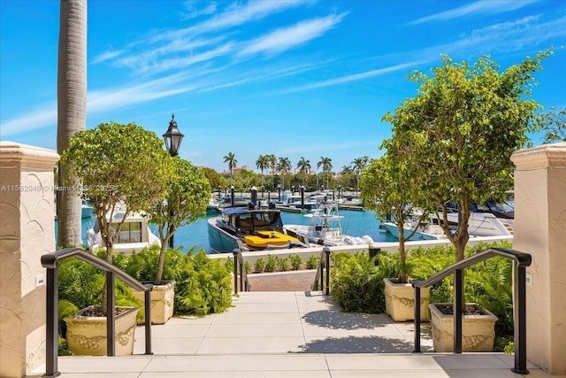 view of community featuring a water view and a dock