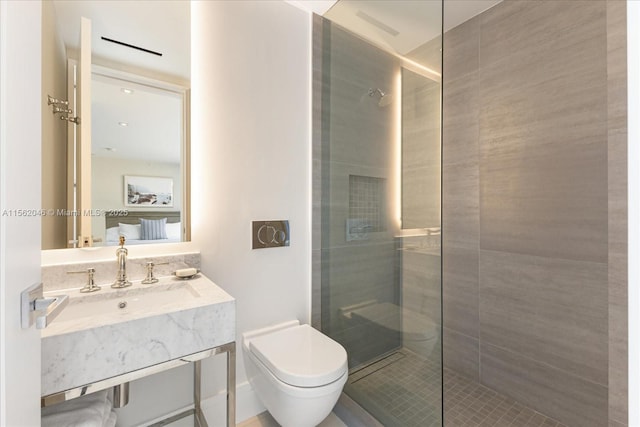 bathroom with vanity, toilet, and a shower with shower door