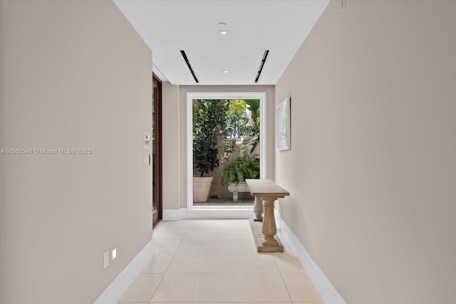 corridor featuring light tile patterned floors