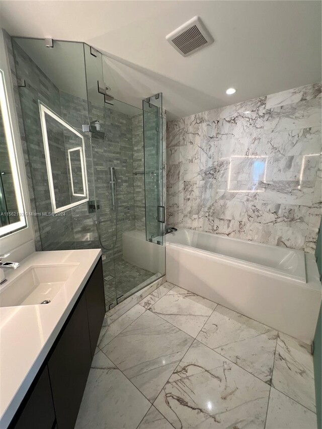 bathroom featuring vanity, plus walk in shower, and tile flooring