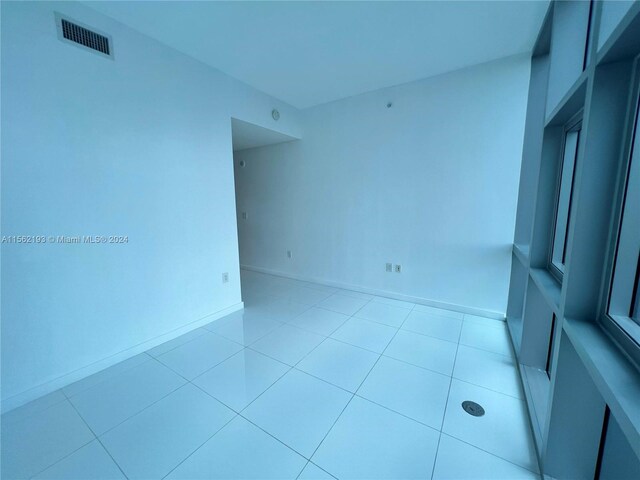 empty room featuring light tile flooring