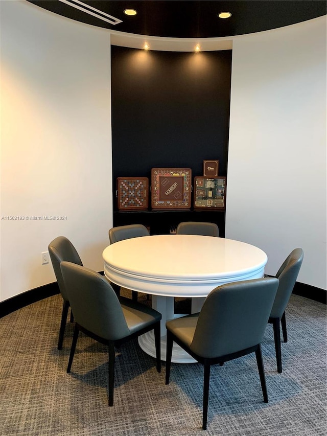 dining space featuring carpet flooring