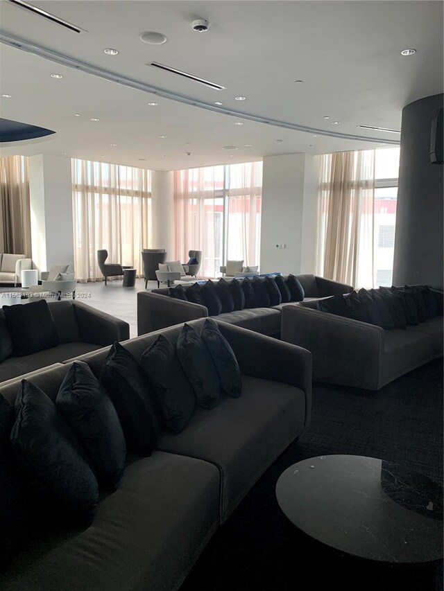 living room featuring floor to ceiling windows