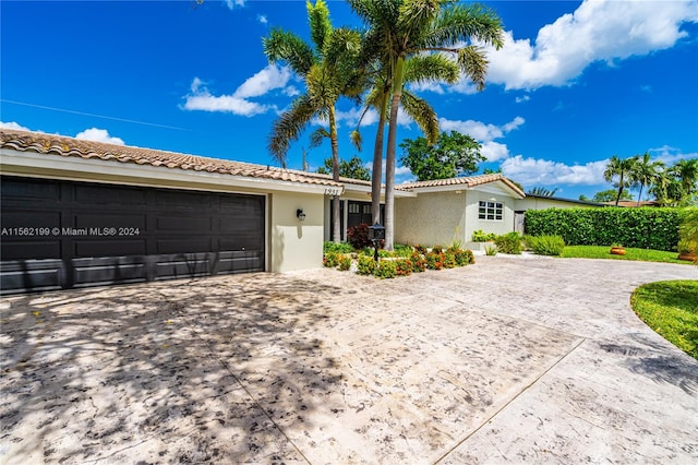 ranch-style home featuring a garage