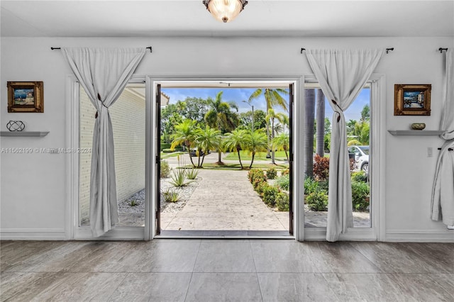 entryway with light tile flooring