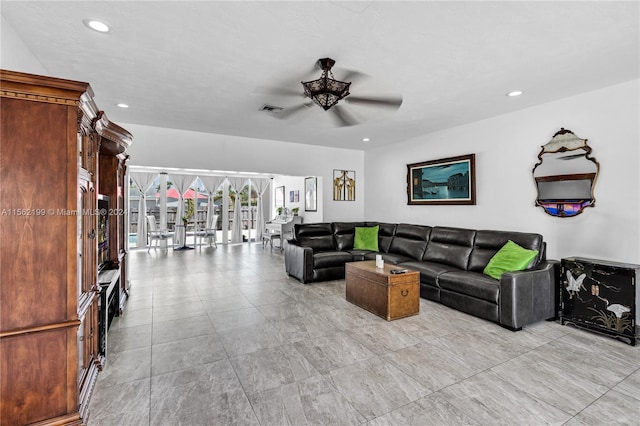 living room featuring light tile flooring and ceiling fan