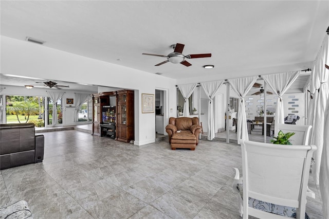 interior space featuring ceiling fan and light tile floors