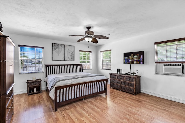 bedroom with ceiling fan and light wood-type flooring