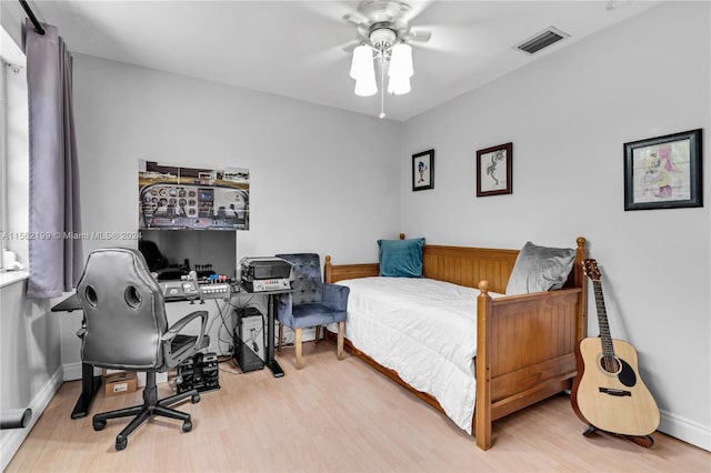 bedroom featuring ceiling fan and light hardwood / wood-style floors