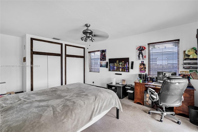 bedroom with light carpet and ceiling fan