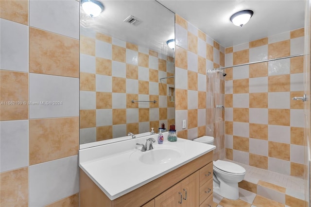 bathroom featuring curtained shower, oversized vanity, toilet, tile walls, and tile floors