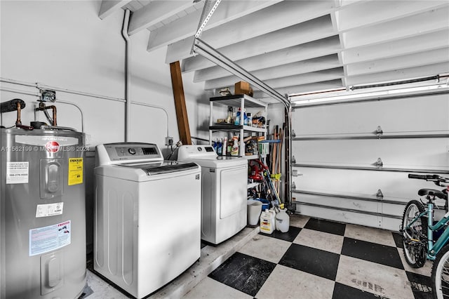 laundry room featuring washer and clothes dryer, electric water heater, and light tile floors