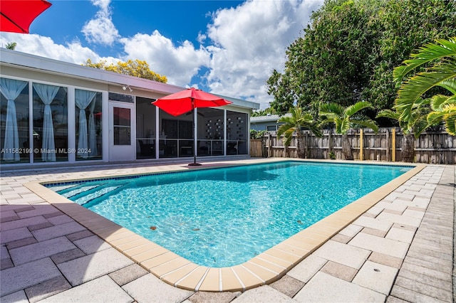 view of swimming pool featuring a patio