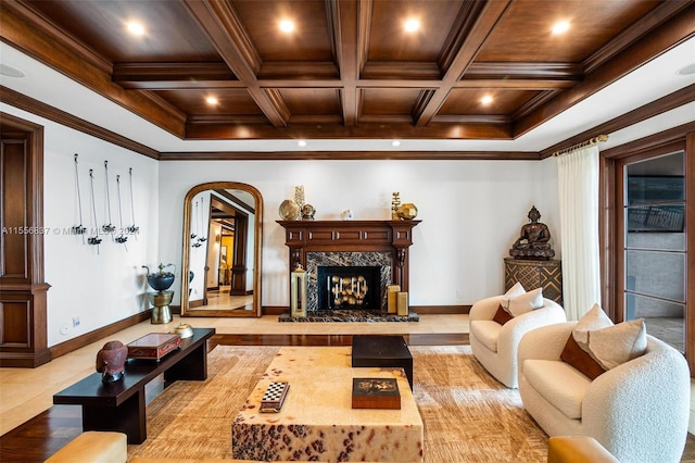 living room featuring coffered ceiling, ornamental molding, and beam ceiling